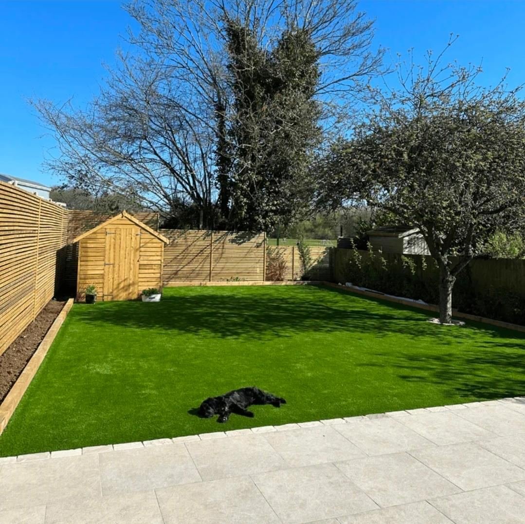 Rear garden landscaping with artificial lawn and shed