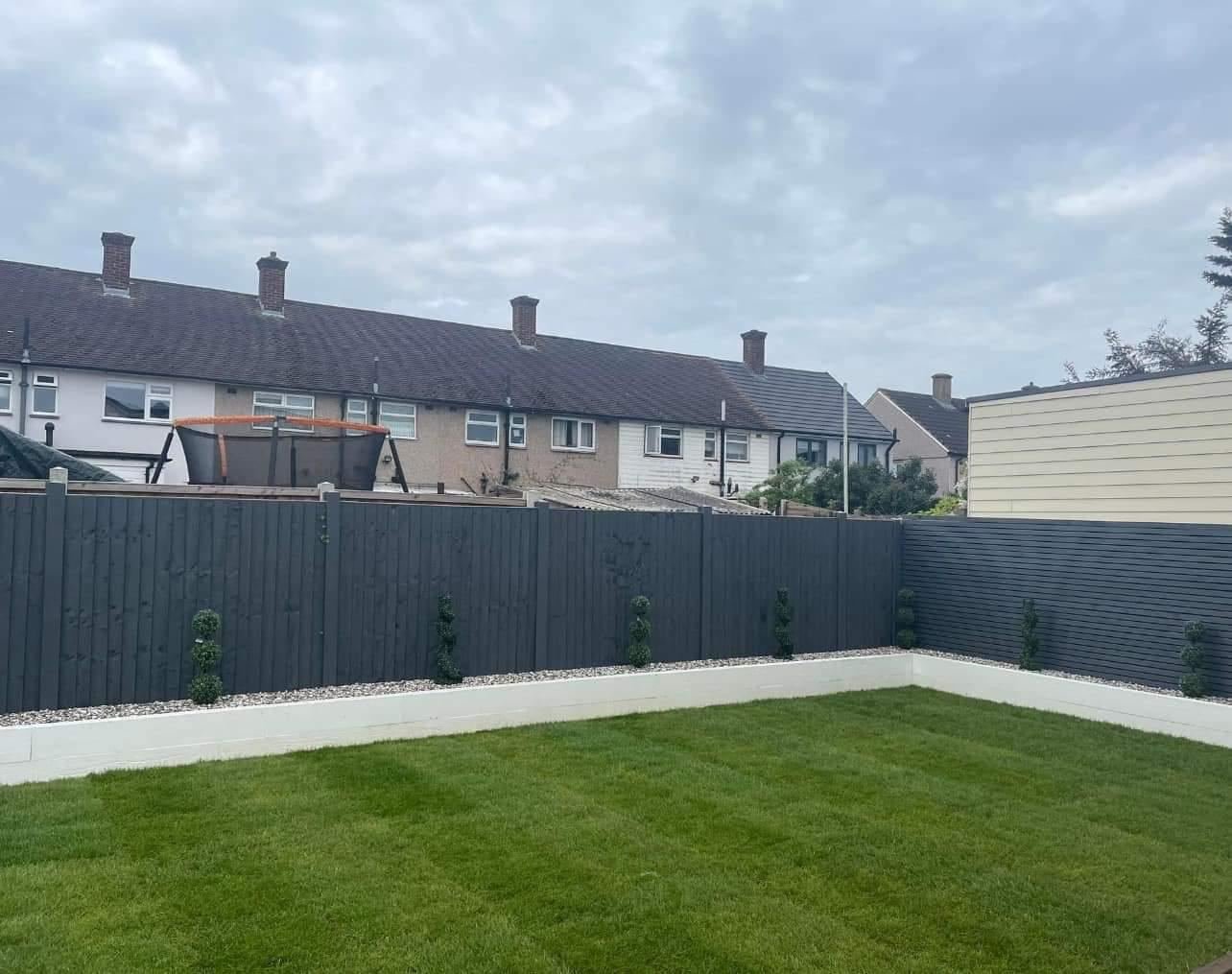 Garden landscaping with new lawn and painted fencing
