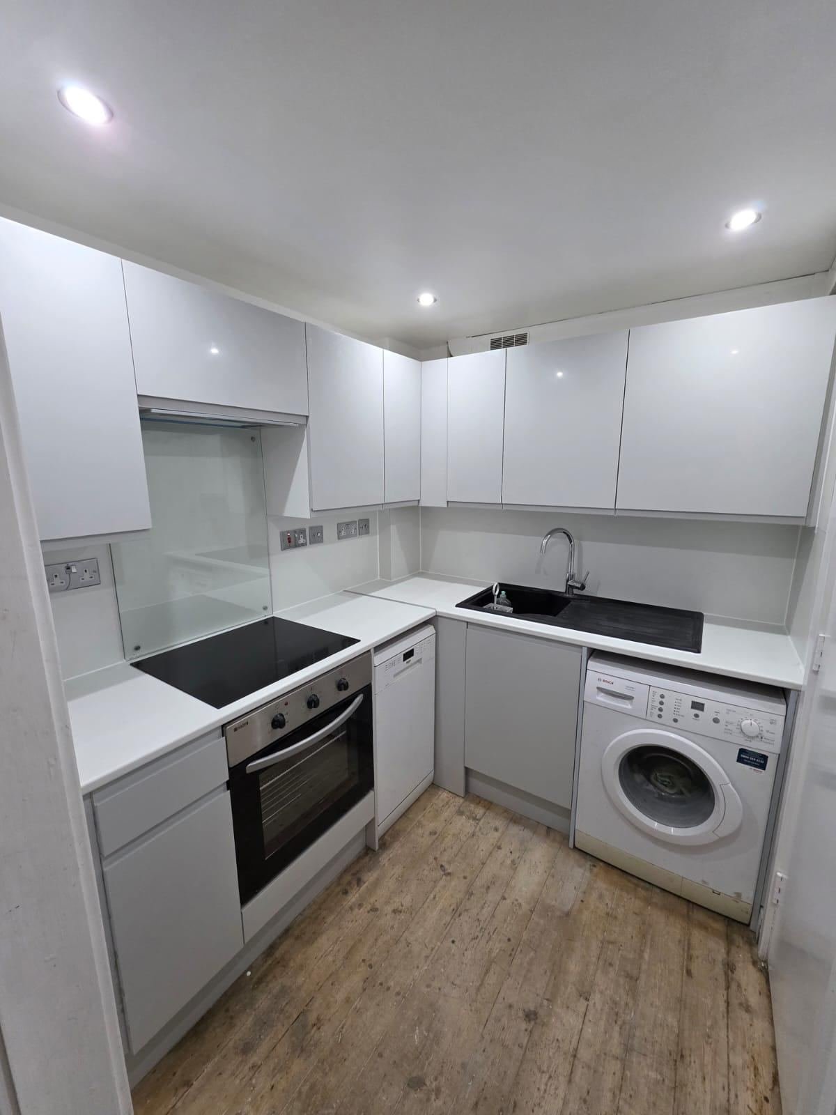 Compact white gloss kitchen refurbishment